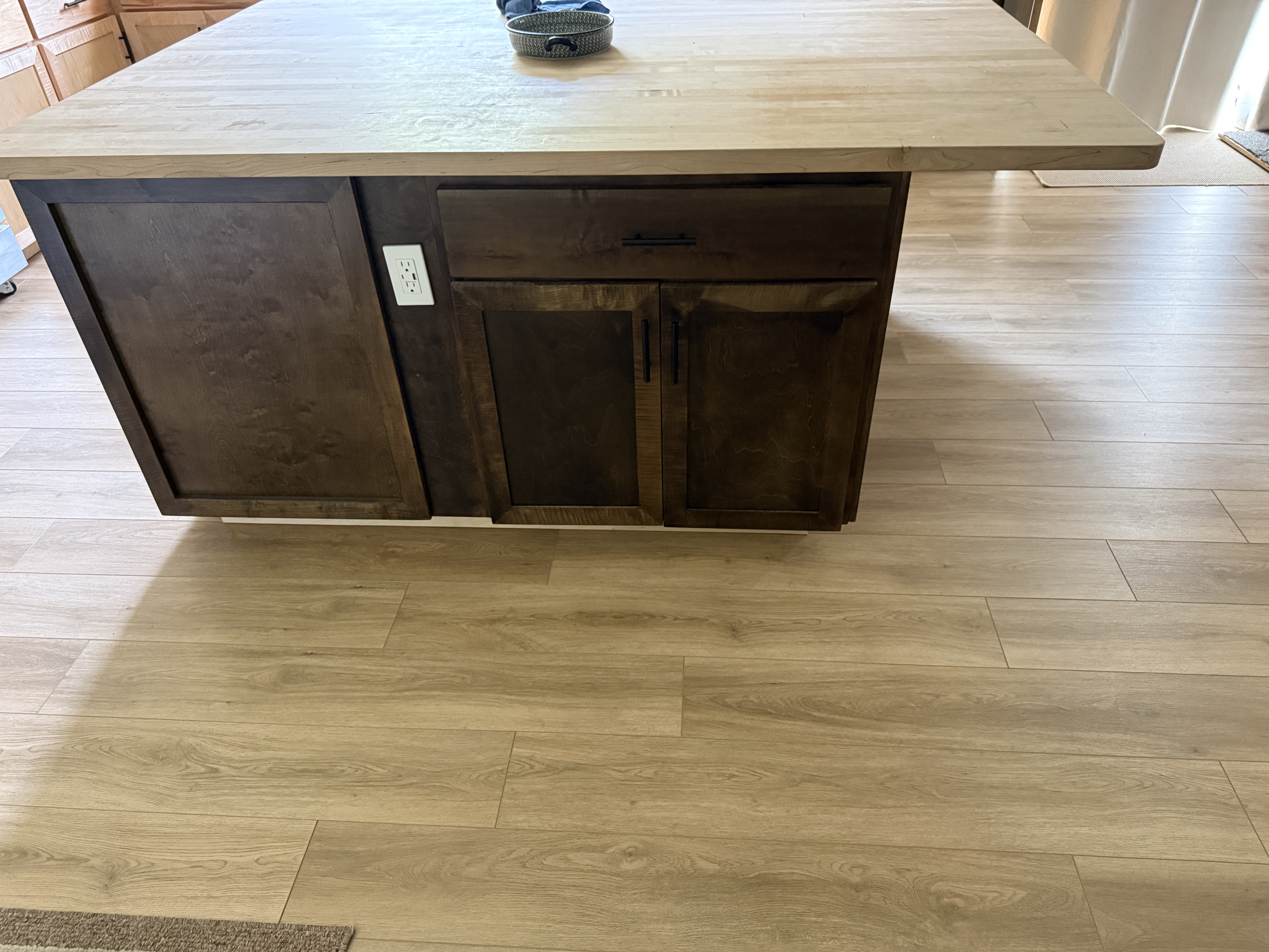 Shadow Point dark-finished island cabinetry